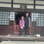 Cheerful American couple visited Kamakura with moist moss after rain.